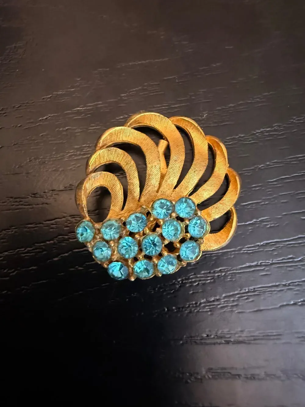 Vintage Gold Tone Blue Rhinestone Swirl Brooch